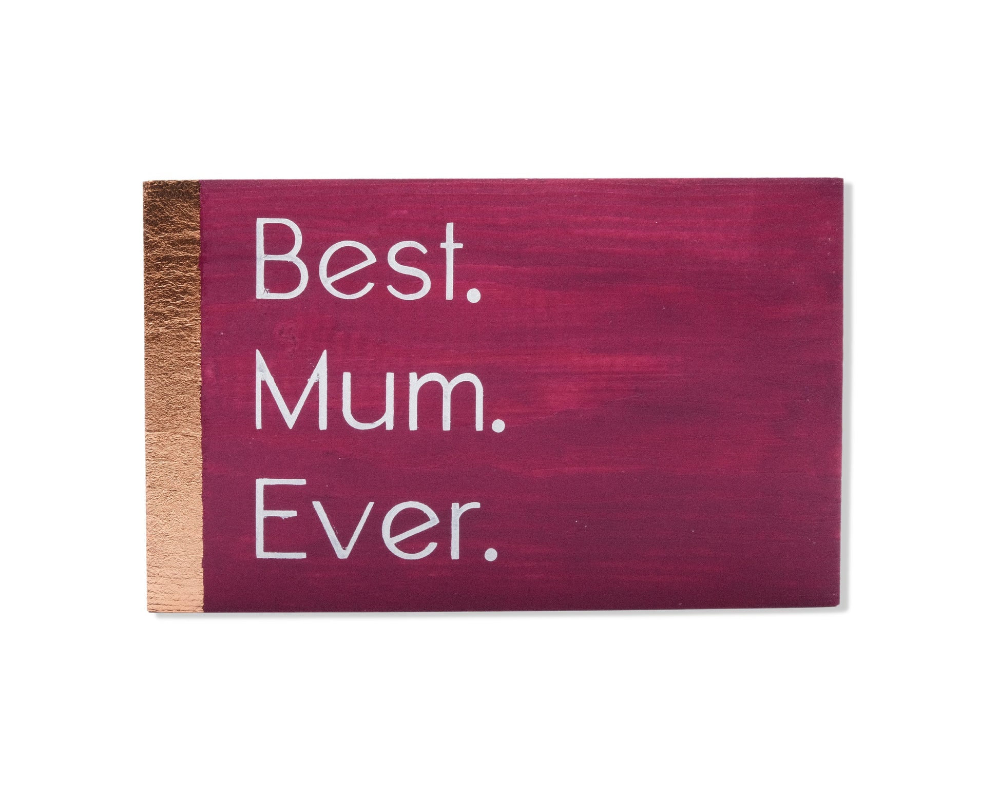 Small freestanding rectangular wooden sign facing straight on. Magenta color with bronze rose gold vertical border on left side only. White painted message, Best. Mum. Ever. Studio style photo on white background.